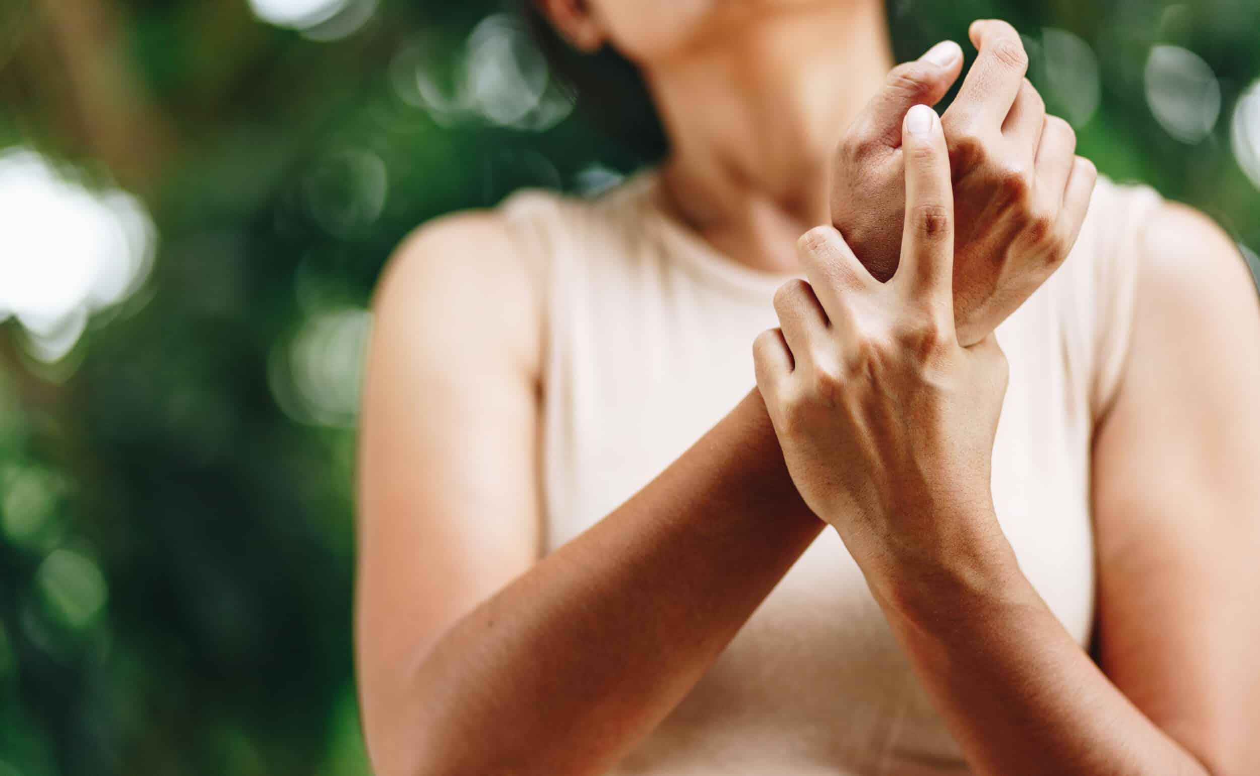 Woman experiencing wrist pain in Ogden, UT